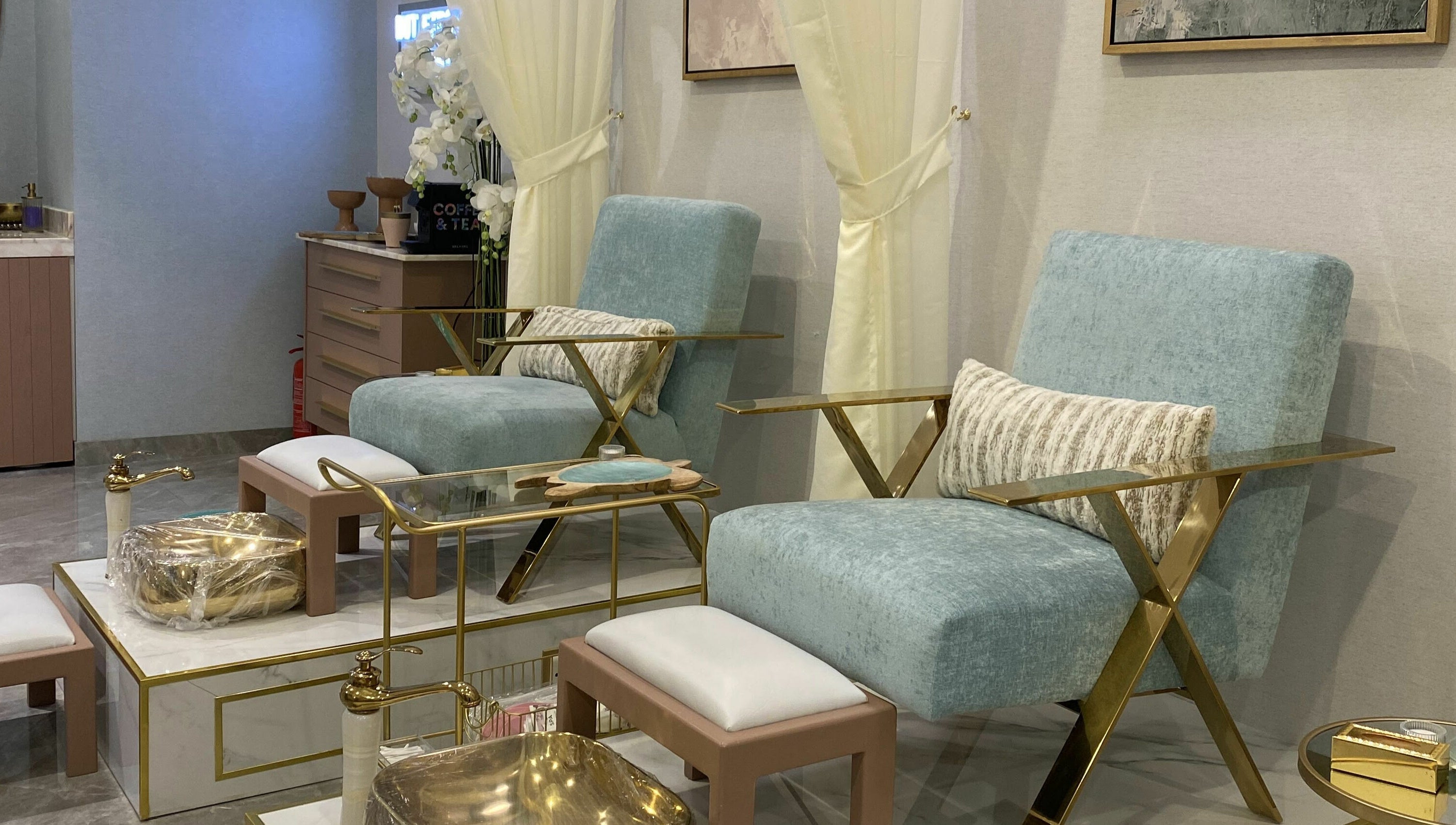 Elegant seating at Mermaid Salon Ghornata, Riyadh, Riyadh Province, SA, featuring plush chairs and gold accents.