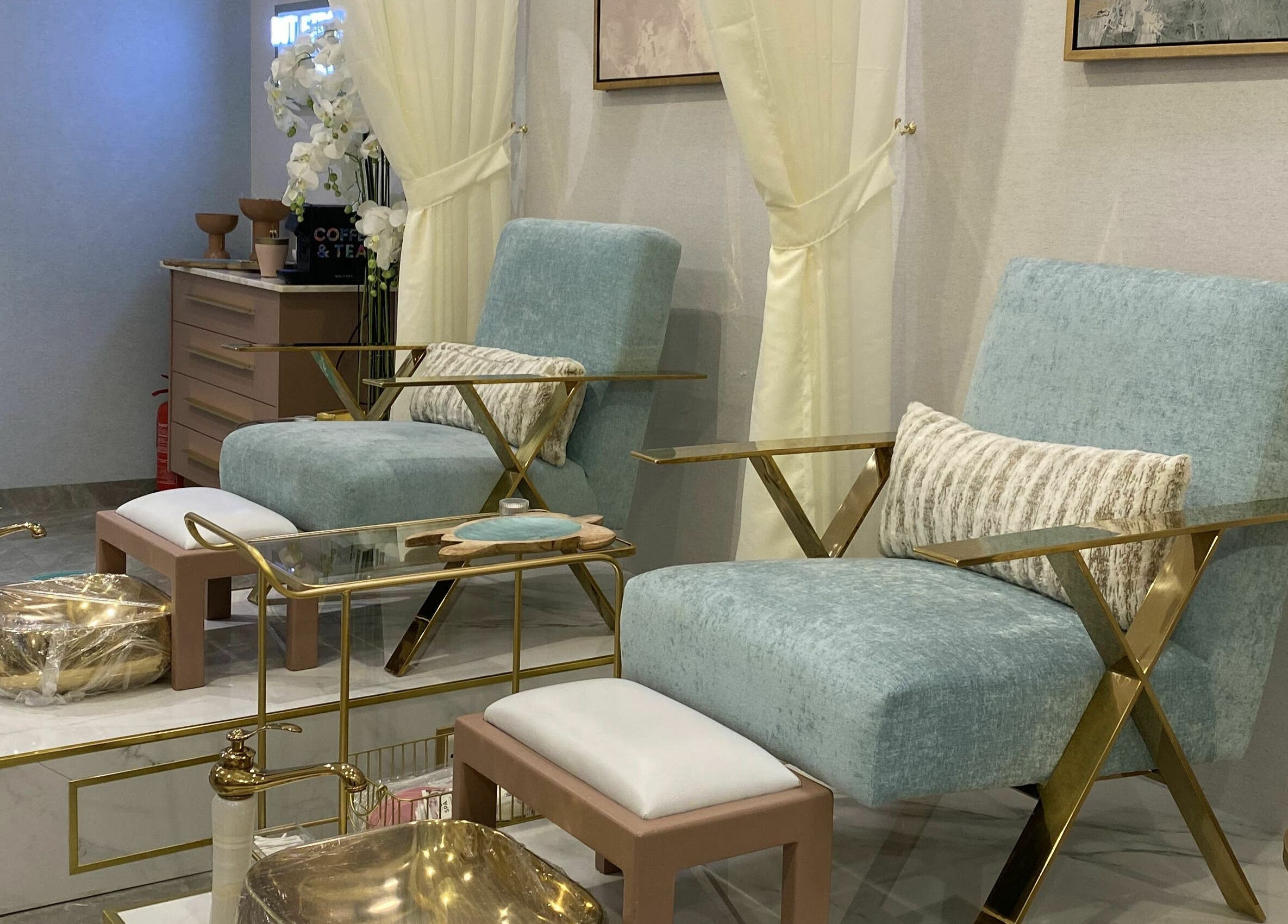 Elegant seating at Mermaid Salon Ghornata, Riyadh, Riyadh Province, SA, featuring plush chairs and gold accents.