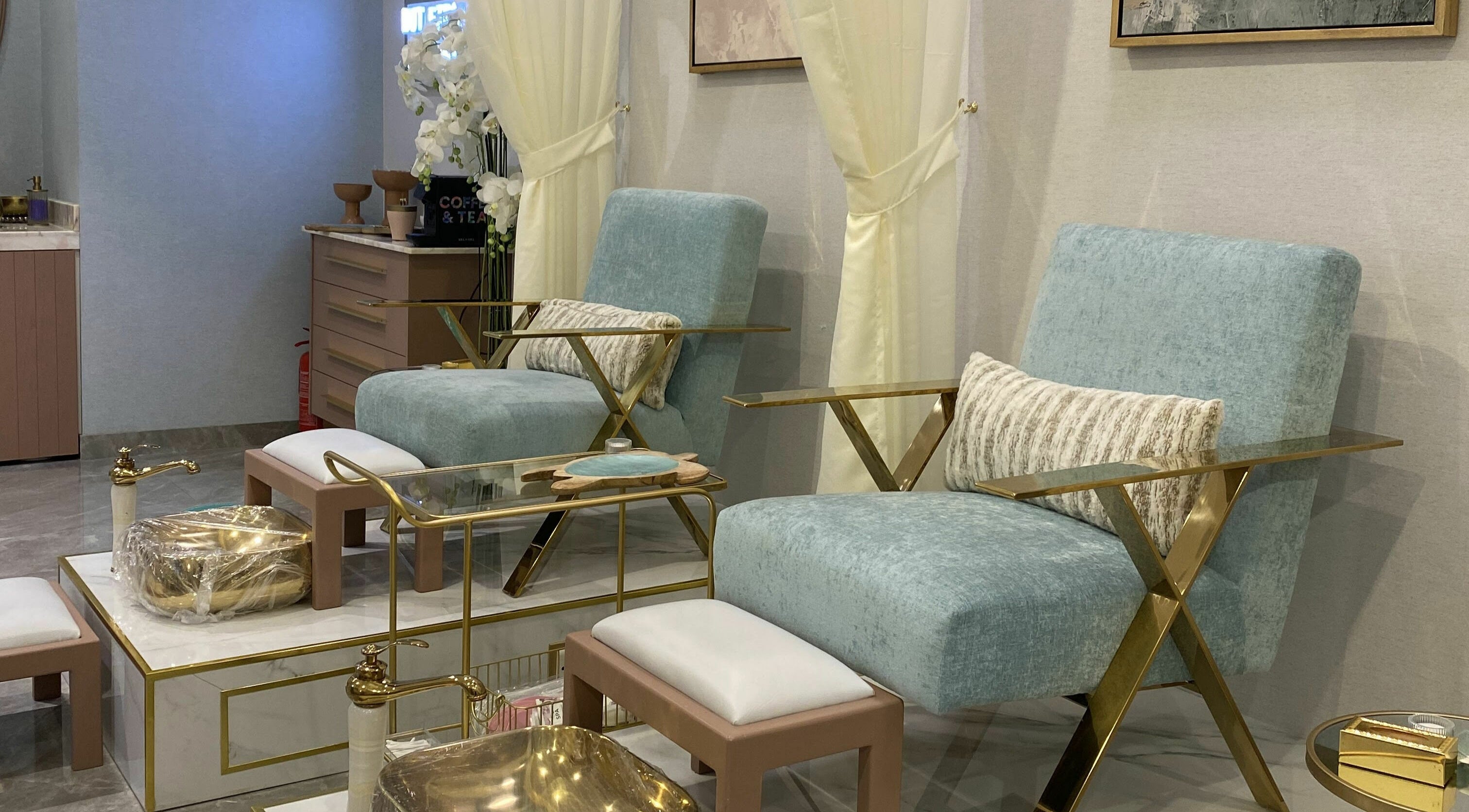 Elegant seating at Mermaid Salon Ghornata, Riyadh, Riyadh Province, SA, featuring plush chairs and gold accents.