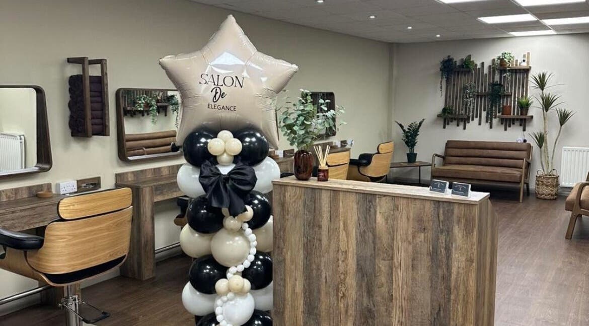 Interior of Navie Studio in Hull, England, GB, featuring modern decor, wooden furnishings, and stylish balloon display.