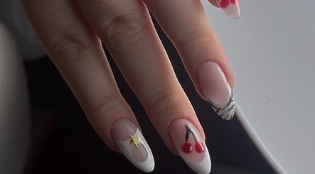 Elegant nail art featuring cherries at Lunar Beauty, Huthwaite, England, GB. Perfect for a stylish look.