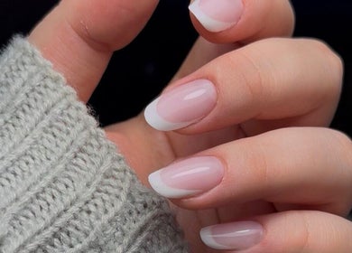 Manicured nails with elegant French tips at Lunar Beauty, Huthwaite, England, GB.
