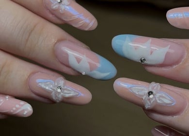 Elegant pastel nail art at Lunar Beauty, Huthwaite, England, GB showcasing floral and abstract designs.
