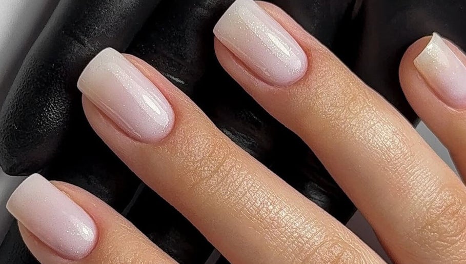 Elegant manicure at Lunar Beauty, Pleasley, England, GB, showcasing soft pink nail polish.