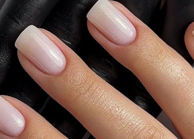 Elegant manicure at Lunar Beauty, Pleasley, England, GB, showcasing soft pink nail polish.