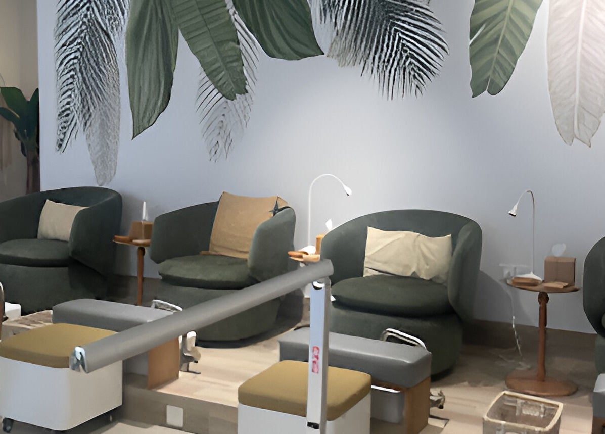 Chic seating area with leafy decor at The Room Boutique Salon, Jeddah, Makkah Province, SA.