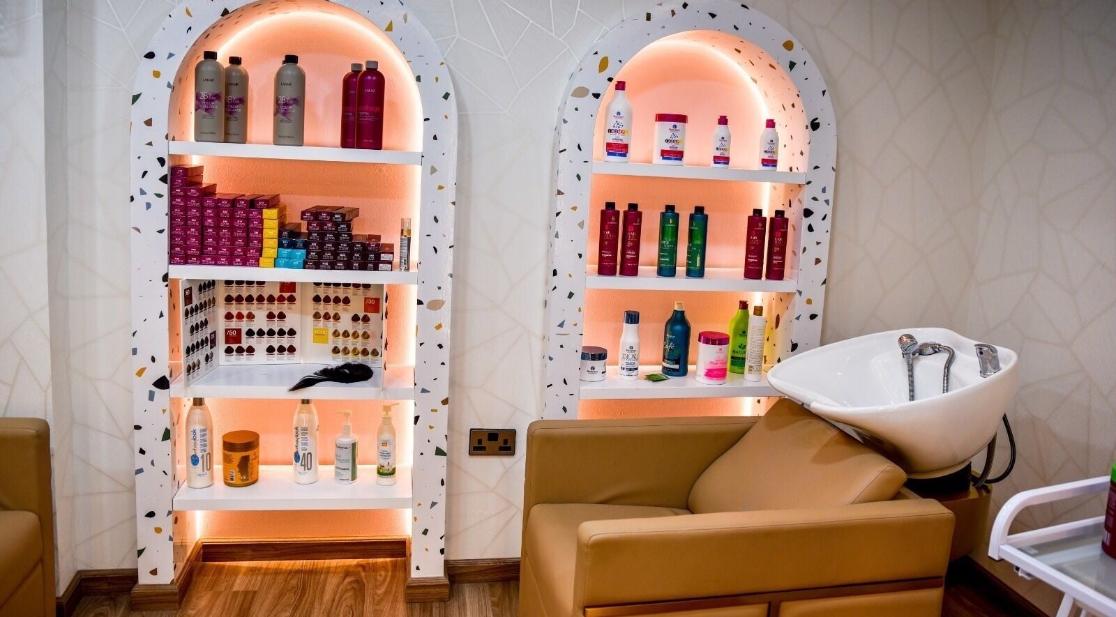 Product shelves at The Beauty Lab Ladies Salon in Abu Dhabi, AE showcasing premium hair and beauty products.