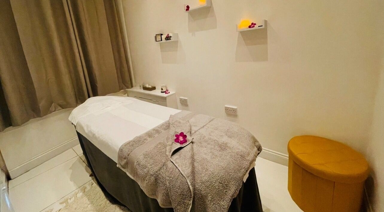 Tranquil massage room at Thai Lotus Sanctuary, Chalfont Saint Peter, England, GB. Cozy setting with calming decor.