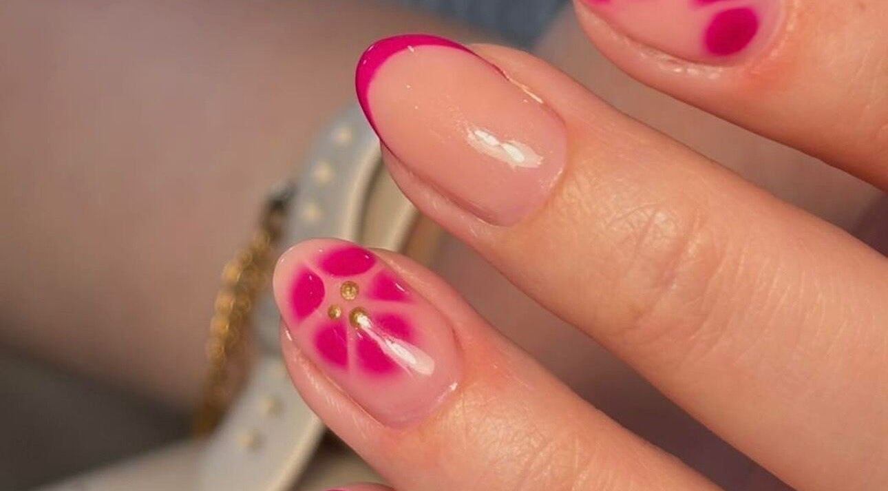 Detailed pink floral nail art at KMbeauty, Ebbw Vale, Wales, GB, showcasing expert manicure skills.