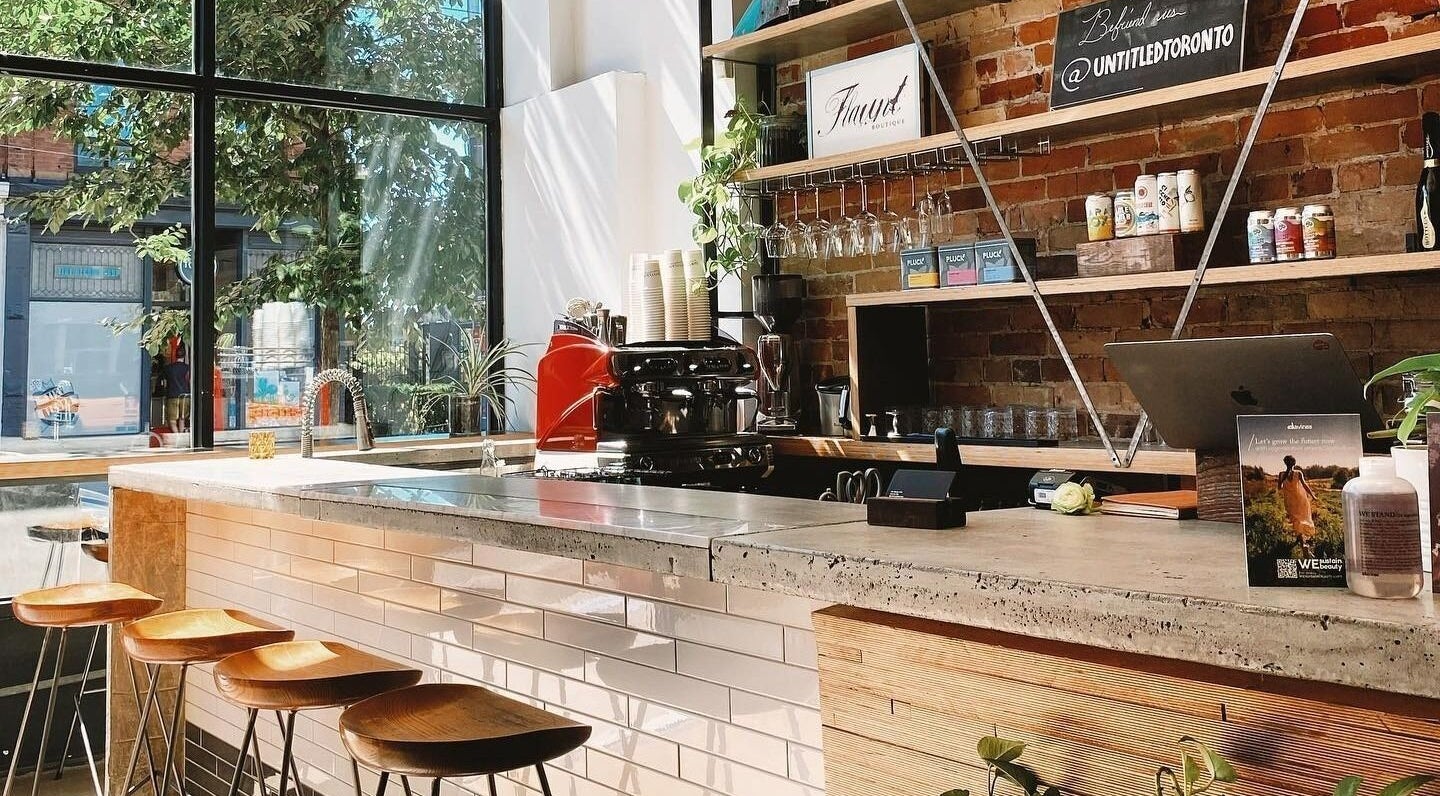 Stylish coffee bar at Untitled by Flaunt Boutique in Toronto, Ontario, CA with natural lighting and modern decor.