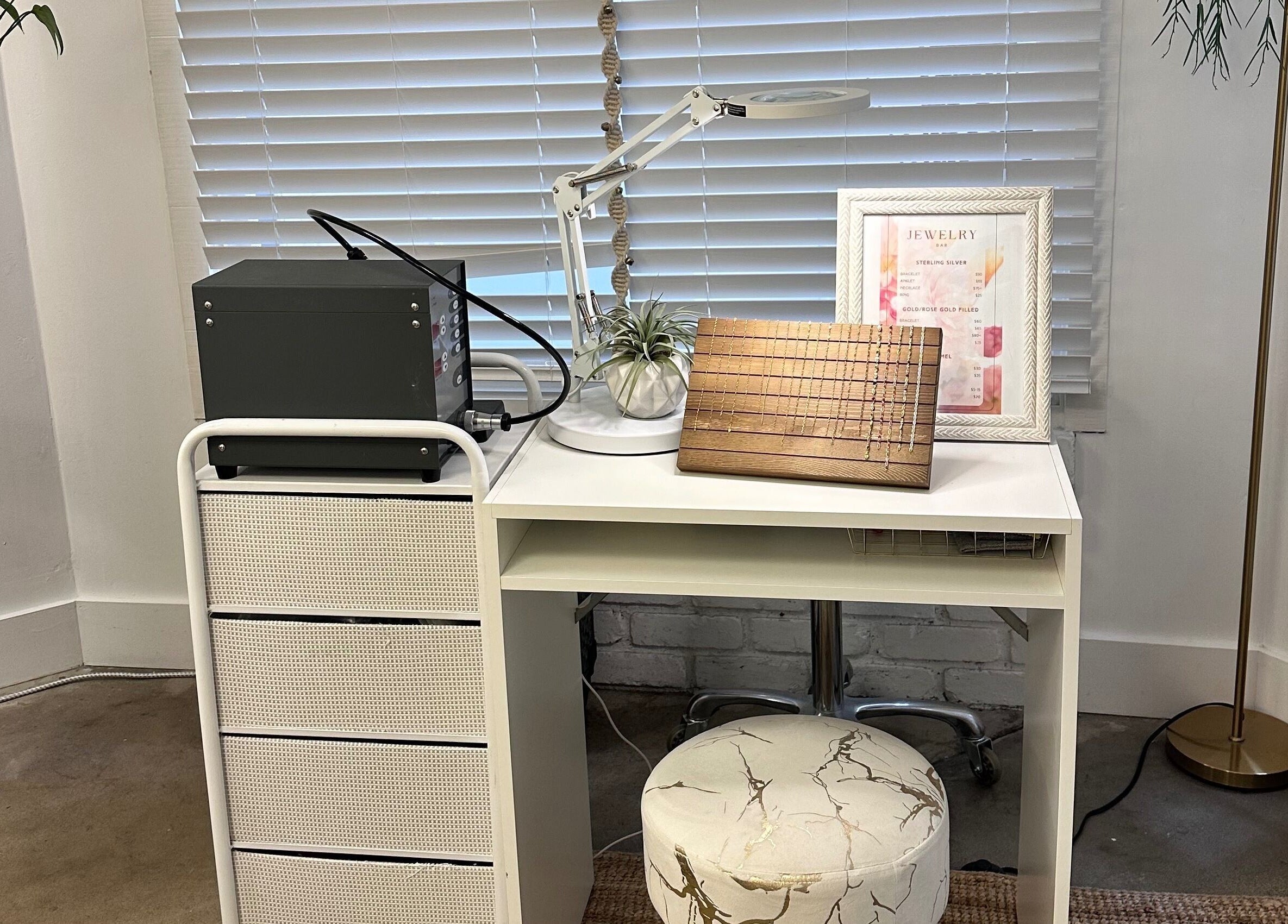Chic beauty workspace at SB Artistry, Costa Mesa, California, US featuring modern decor and bright lighting.