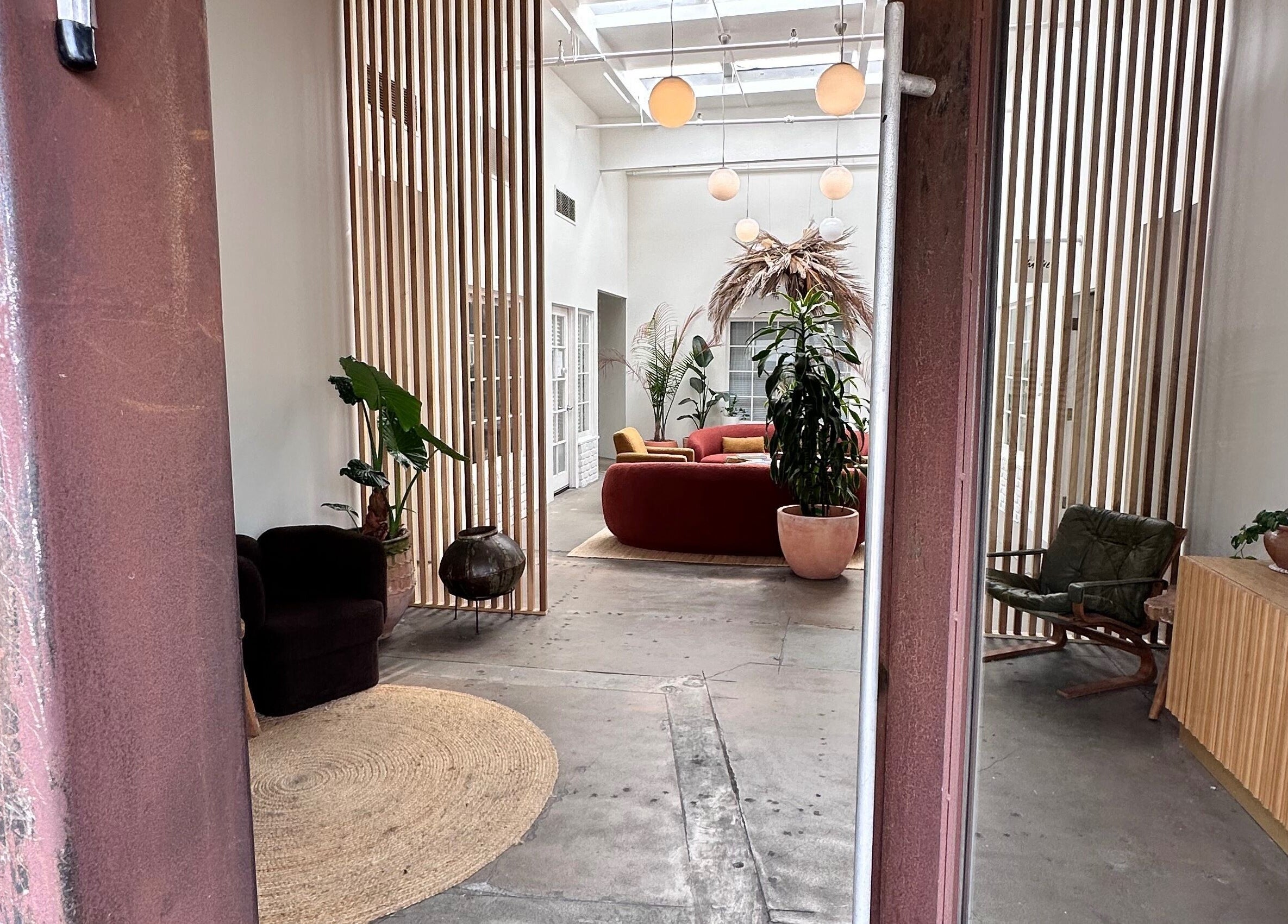 Cozy lounge at SB Artistry, Costa Mesa, California, US with stylish decor and plush seating.