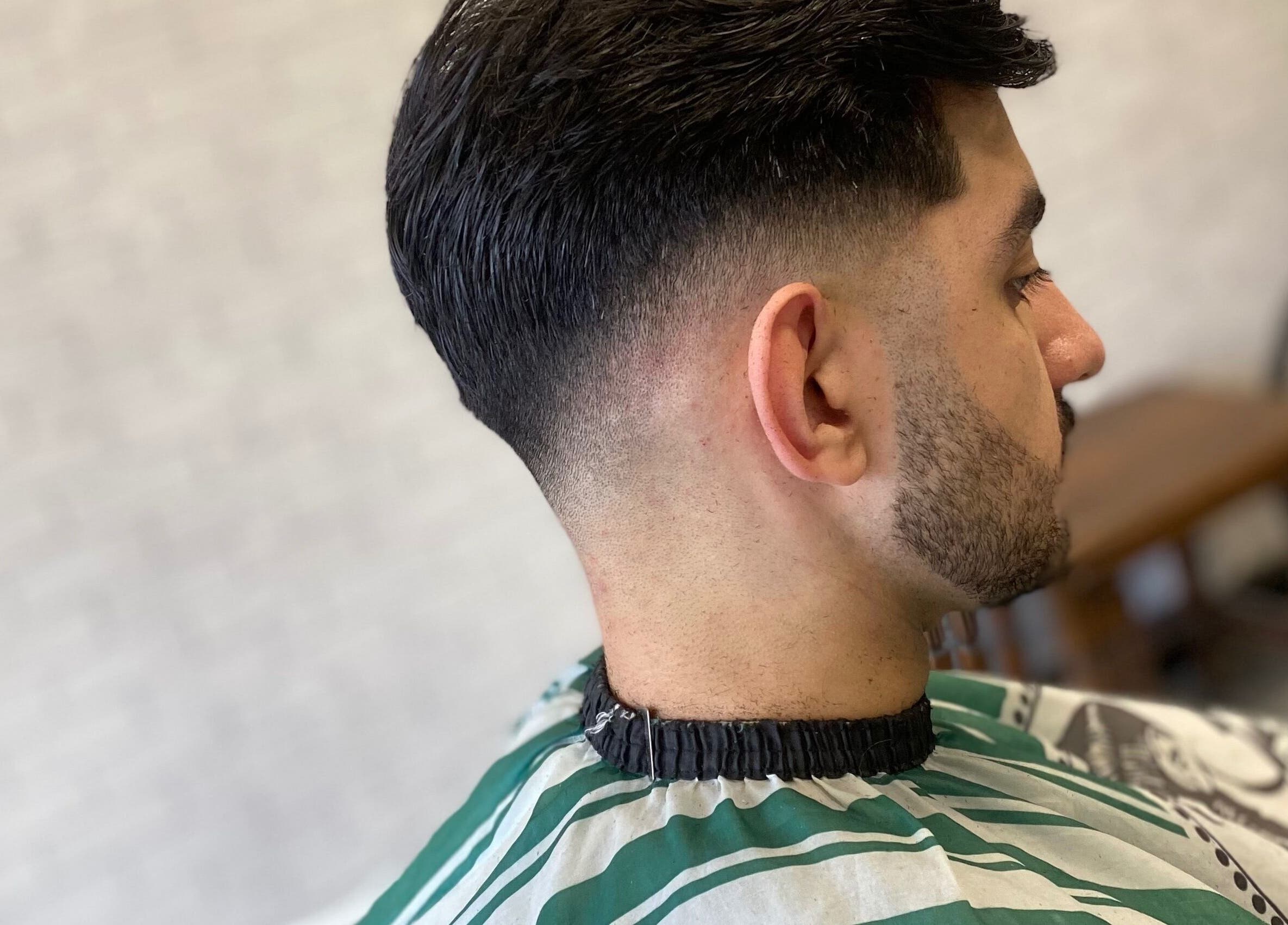Close-up of a stylish fade haircut at Hm Barbers in London, England, GB.