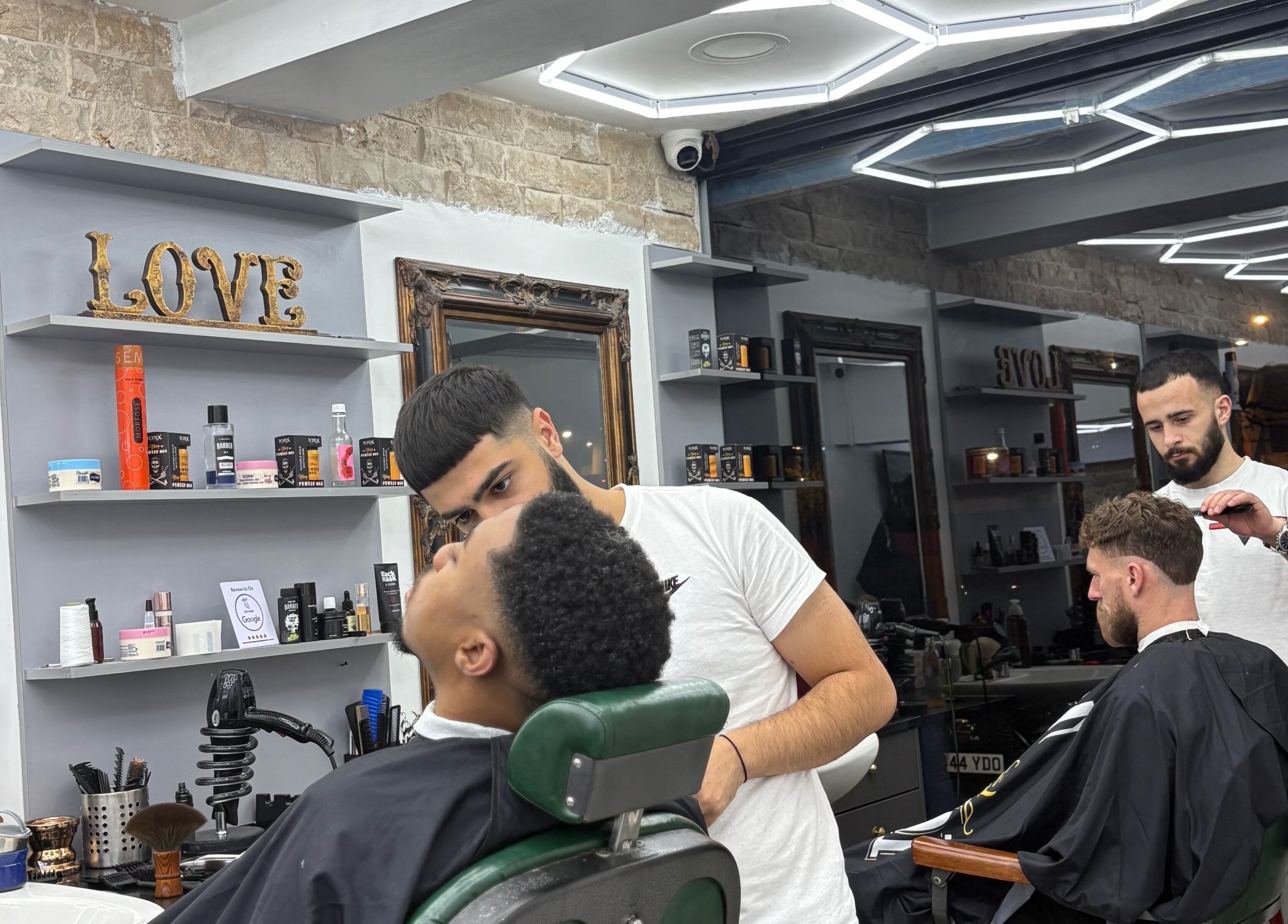 Stylish haircut at Hm barbers, London, England, GB, showcasing expert grooming.