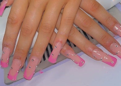 Sheer Dollz nail art with pink tips and rhinestones, London, England, GB.