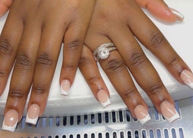 Stylish French manicure design at Sheer Dollz, London, England, GB showcasing elegant nail art.