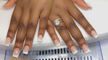 Stylish French manicure design at Sheer Dollz, London, England, GB showcasing elegant nail art.