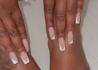 Elegant nail art featuring nude and white designs at Sheer Dollz, London, England, GB.