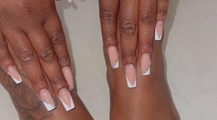 Elegant nail art featuring nude and white designs at Sheer Dollz, London, England, GB.