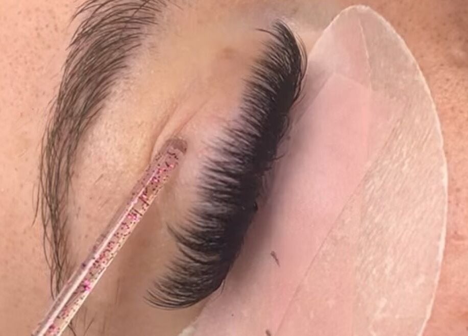 Close-up of eyelash extension application at Divine Beauty, Milton Keynes, England, GB.