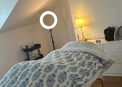 Cozy treatment room at Rebecca Duffy Advanced Skin, Belfast, Northern Ireland, GB with soothing lighting and decor.