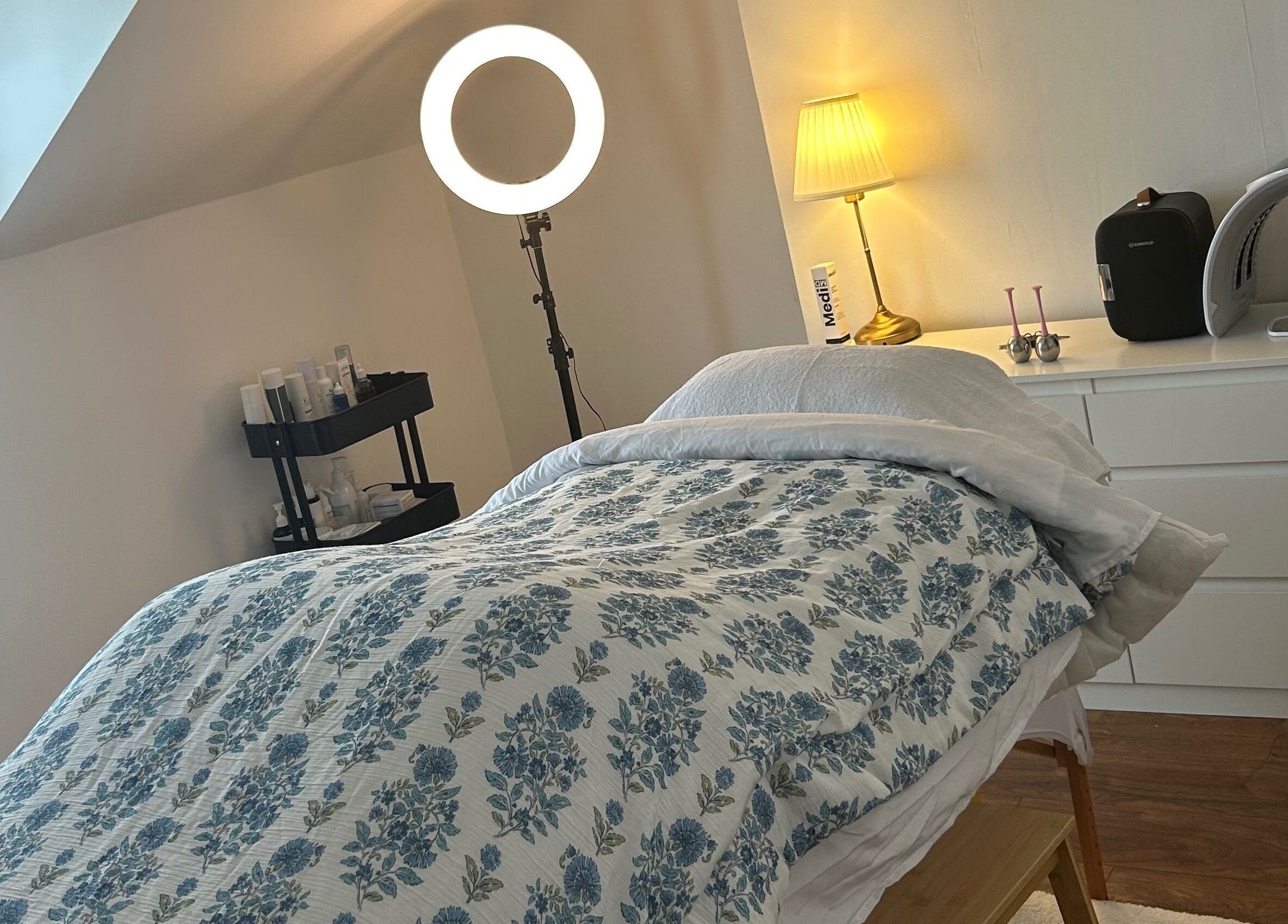 Relaxing treatment room at Rebecca Duffy Advanced Skin, Belfast, Northern Ireland, GB, featuring cozy decor.