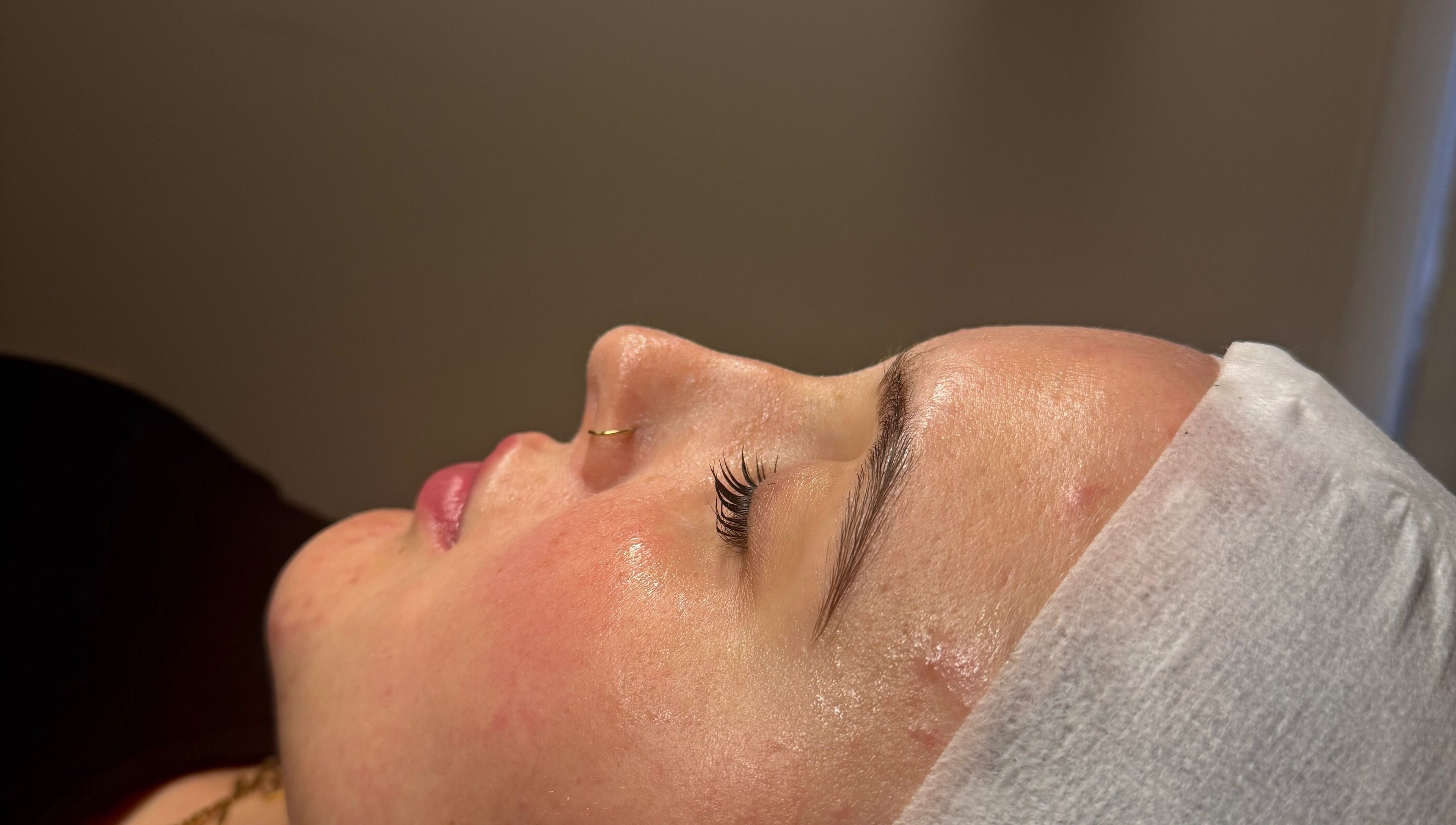 Close-up of a serene face with glowing skin at Afterglow Beauty Ltd, Goole, England, GB.