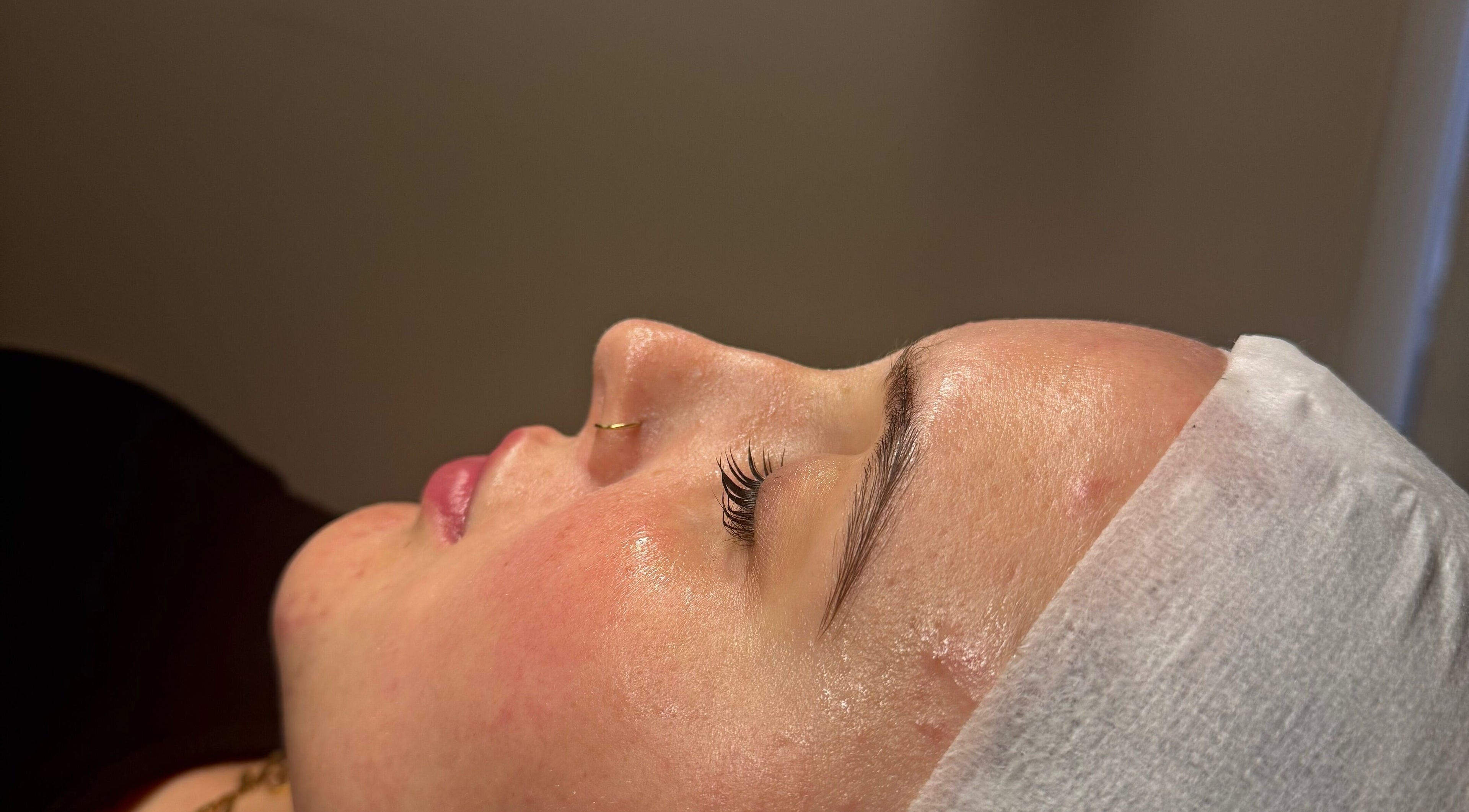 Close-up of a serene face with glowing skin at Afterglow Beauty Ltd, Goole, England, GB.
