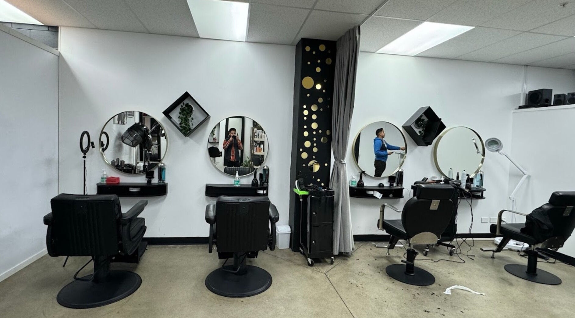 Interior of Exotic Salon (Unisex - Hair and Beauty) in Auckland, Auckland, NZ with elegant styling stations.