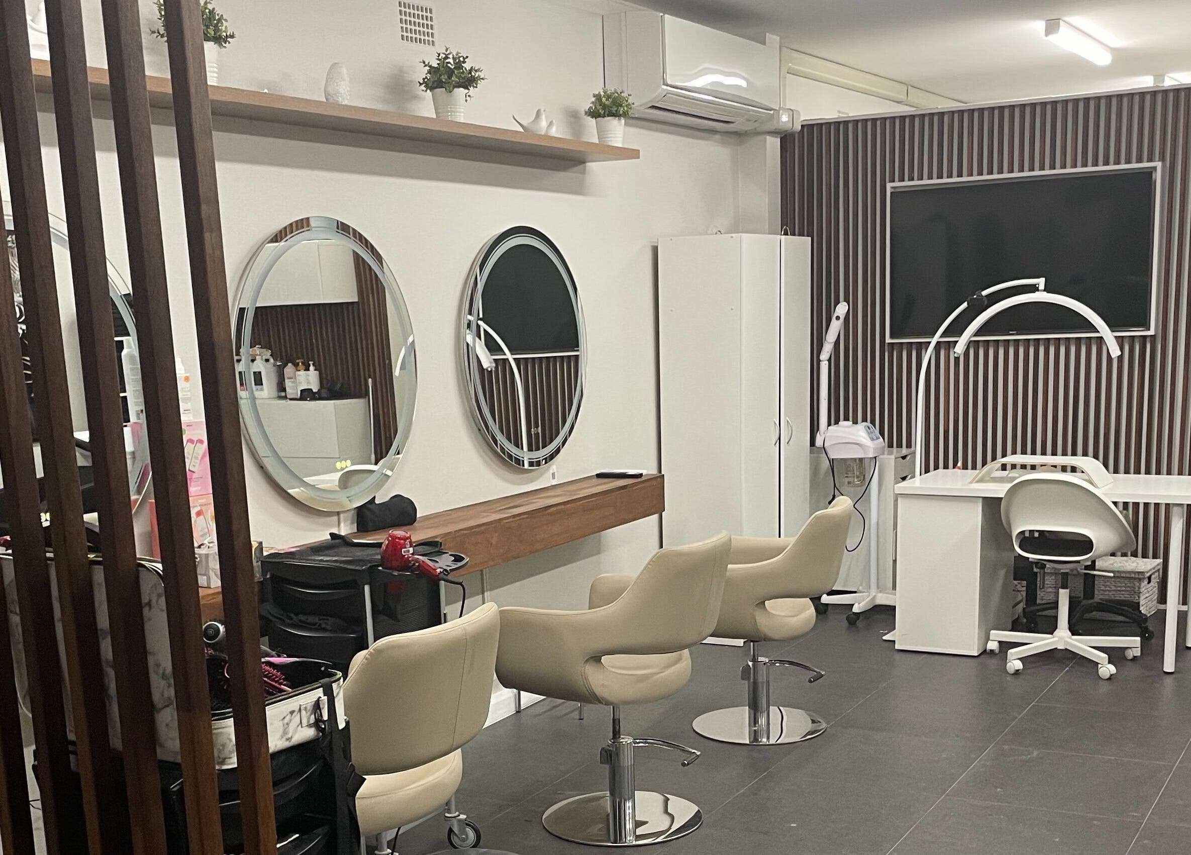 Interior of Carmen Marie Beauty salon in Maroubra, New South Wales, AU showcasing stylish chairs and mirrors.