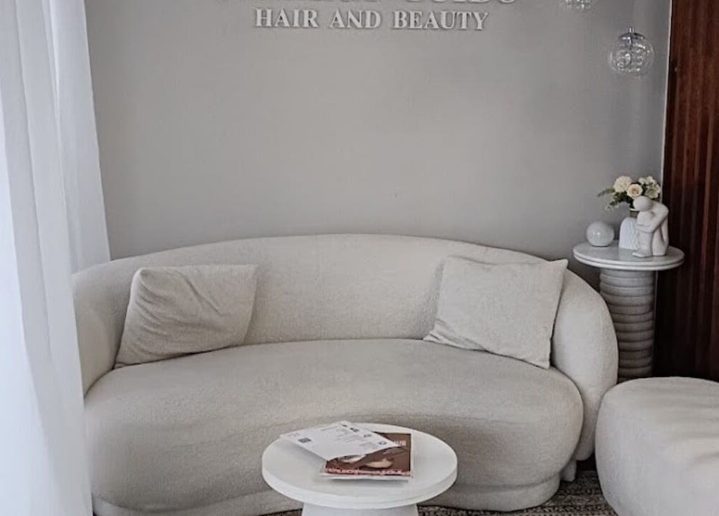 Elegant lounge space at Carmen Marie Beauty, Maroubra, New South Wales, AU. Cozy seating with modern decor.