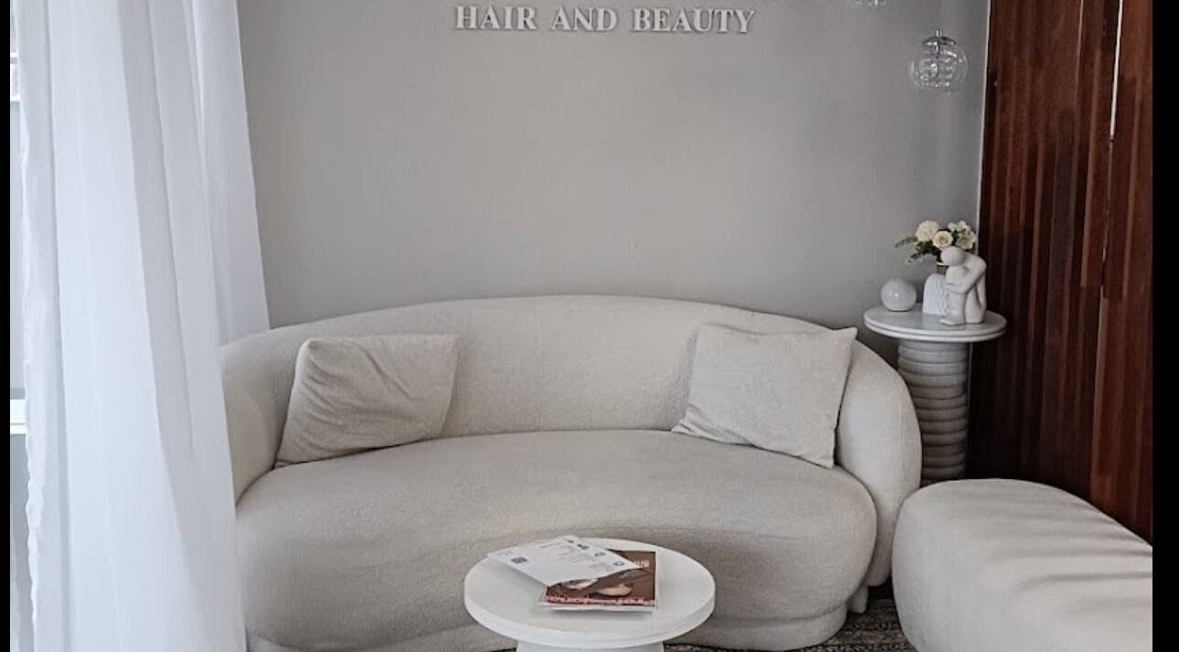 Elegant lounge space at Carmen Marie Beauty, Maroubra, New South Wales, AU. Cozy seating with modern decor.