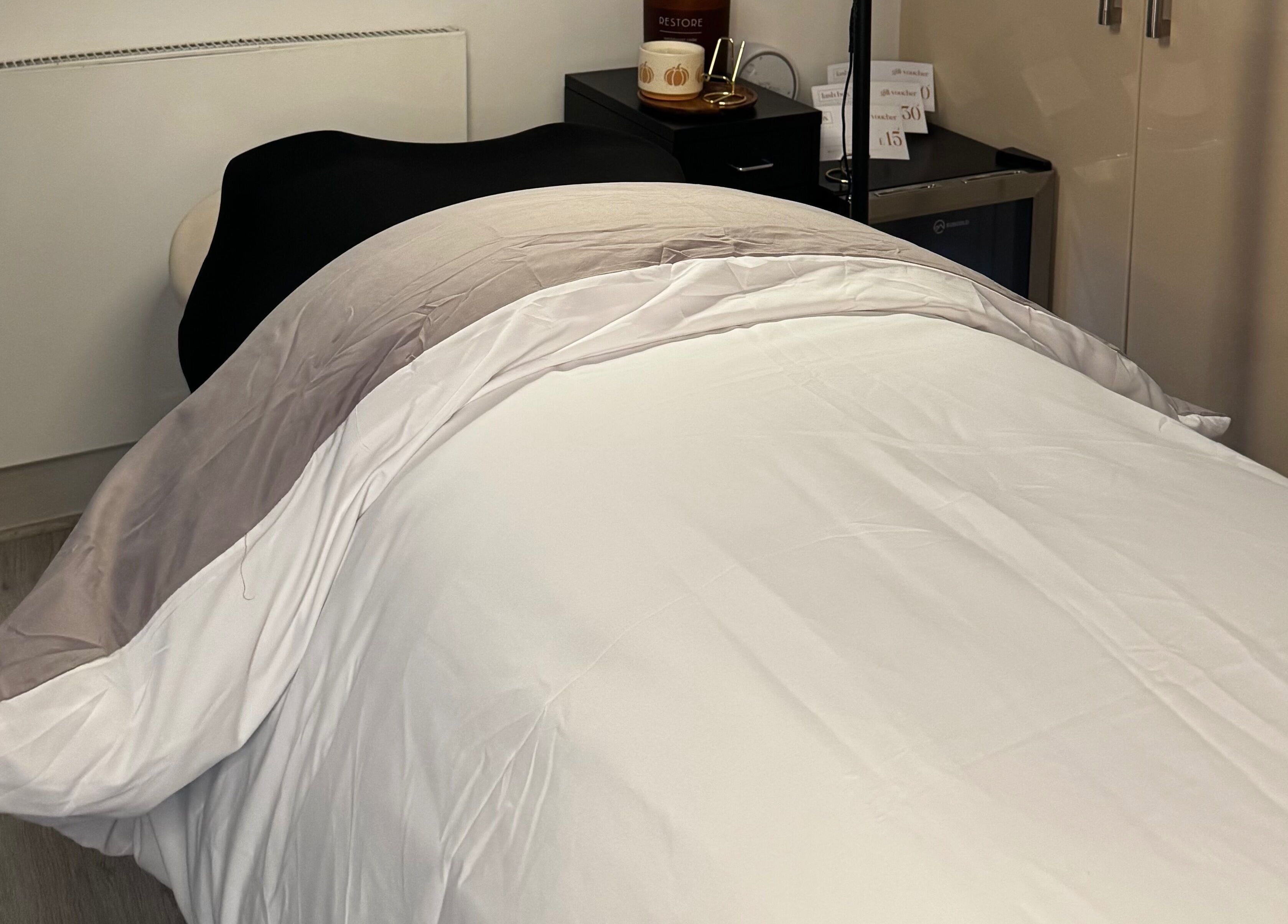 Relaxing treatment bed at Lash Box Mcr in Greenmount, England, GB, showcasing comfort and elegance.