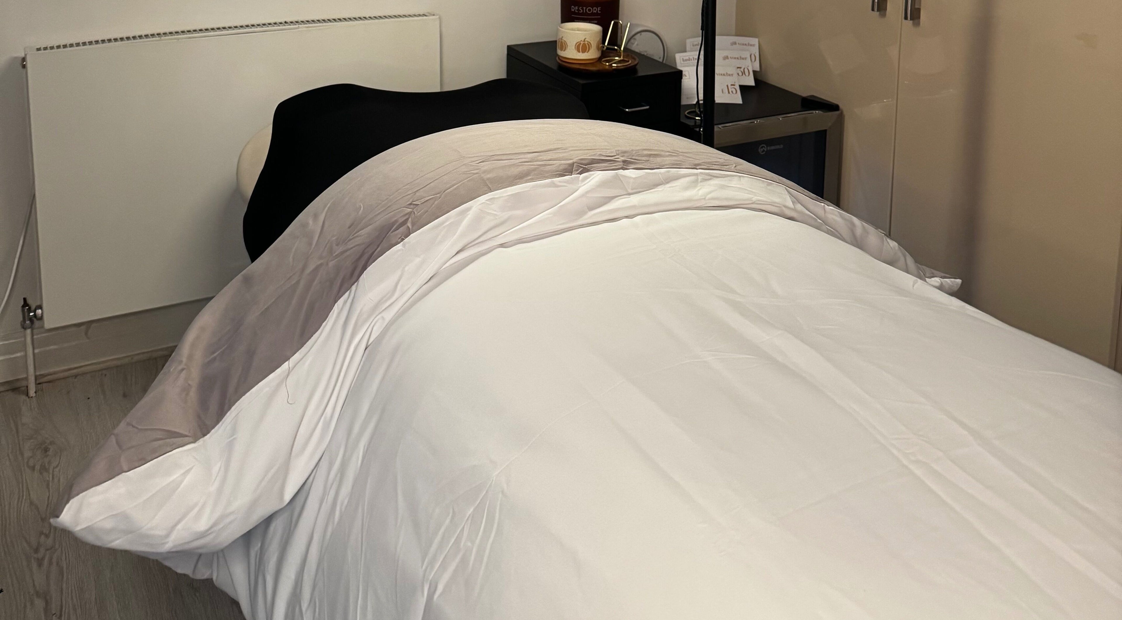 Relaxing treatment bed at Lash Box Mcr in Greenmount, England, GB, showcasing comfort and elegance.