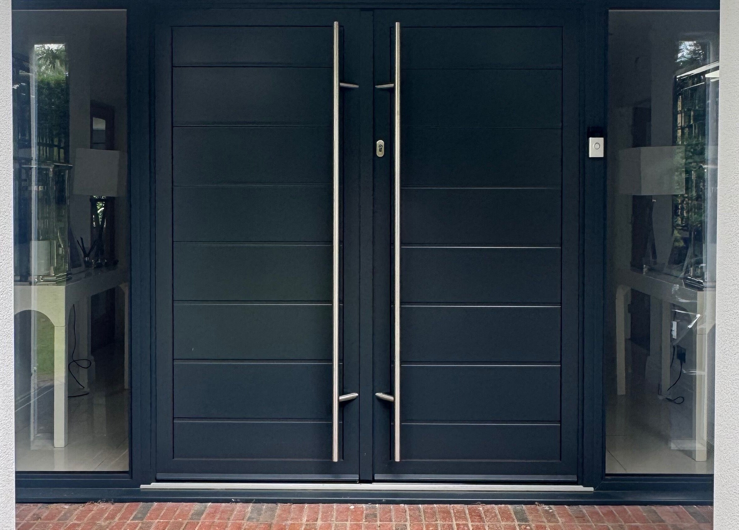 Modern black double doors at Lash Box Mcr in Greenmount, England, GB.