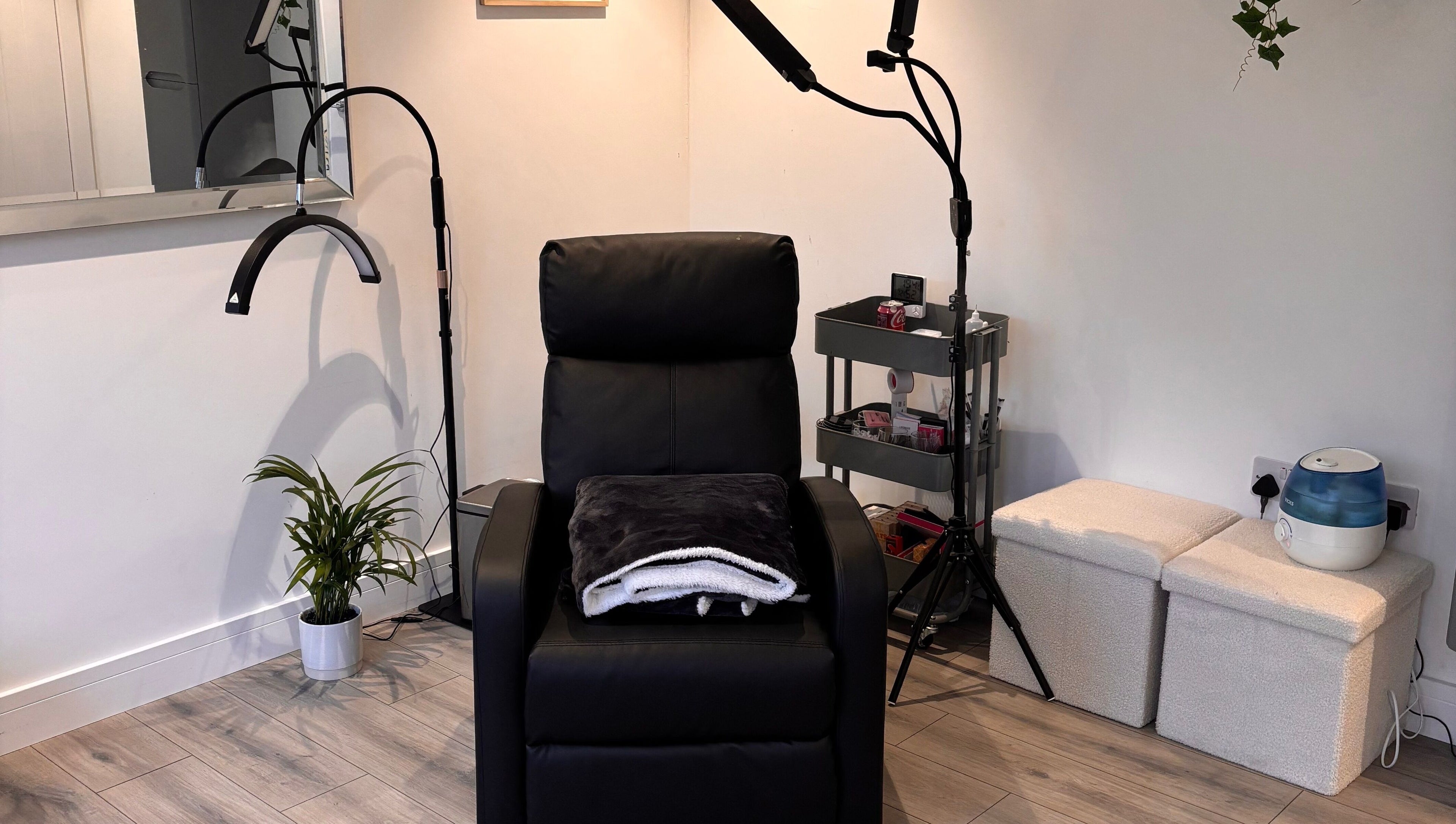 Comfortable treatment chair at Beauty Hall in Watford, England, GB, surrounded by minimalist decor.