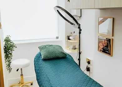 Calming treatment room at Brazilian Aesthetics, Dublin, County Dublin, IE, featuring a teal bed and modern decor.