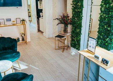 Chic reception area at Brazilian Aesthetics, Dublin, County Dublin, IE, with green accents and stylish decor.