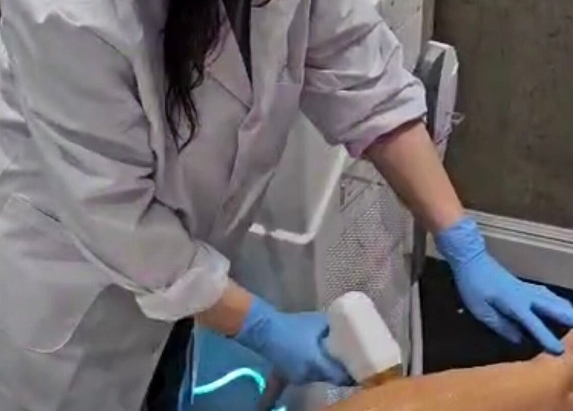 Laser hair removal at Beauty Land and Aesthetics in Glasgow, Scotland, GB, with a professional applying treatment.