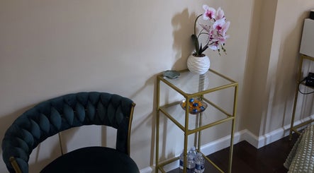 Stylish waiting area at Innersol Skincare, Fair Lawn, New Jersey, US with a plush chair and orchid decor.
