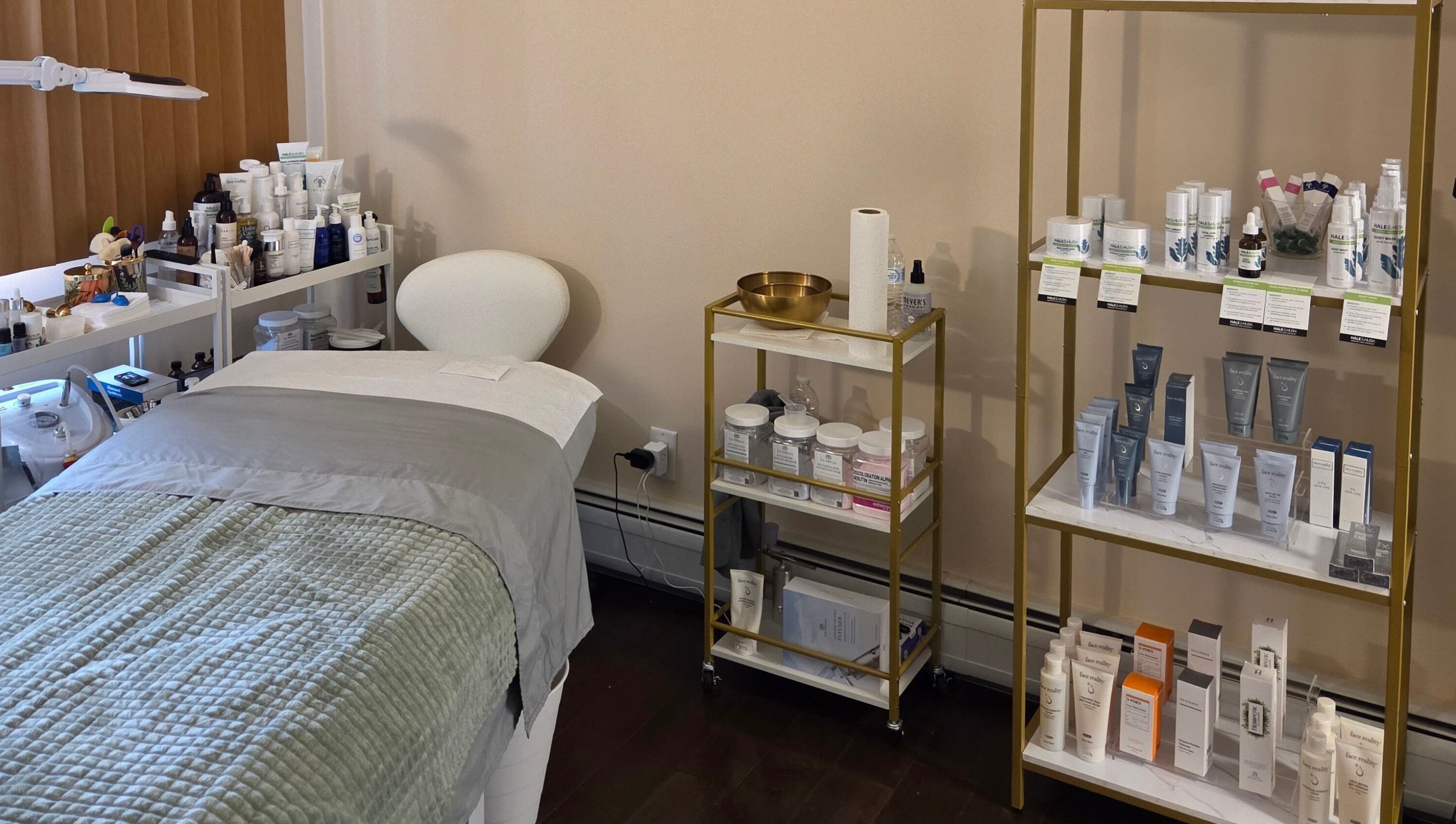 Innersol Skincare treatment room in Fair Lawn, New Jersey, US showcasing products and a cozy bed.