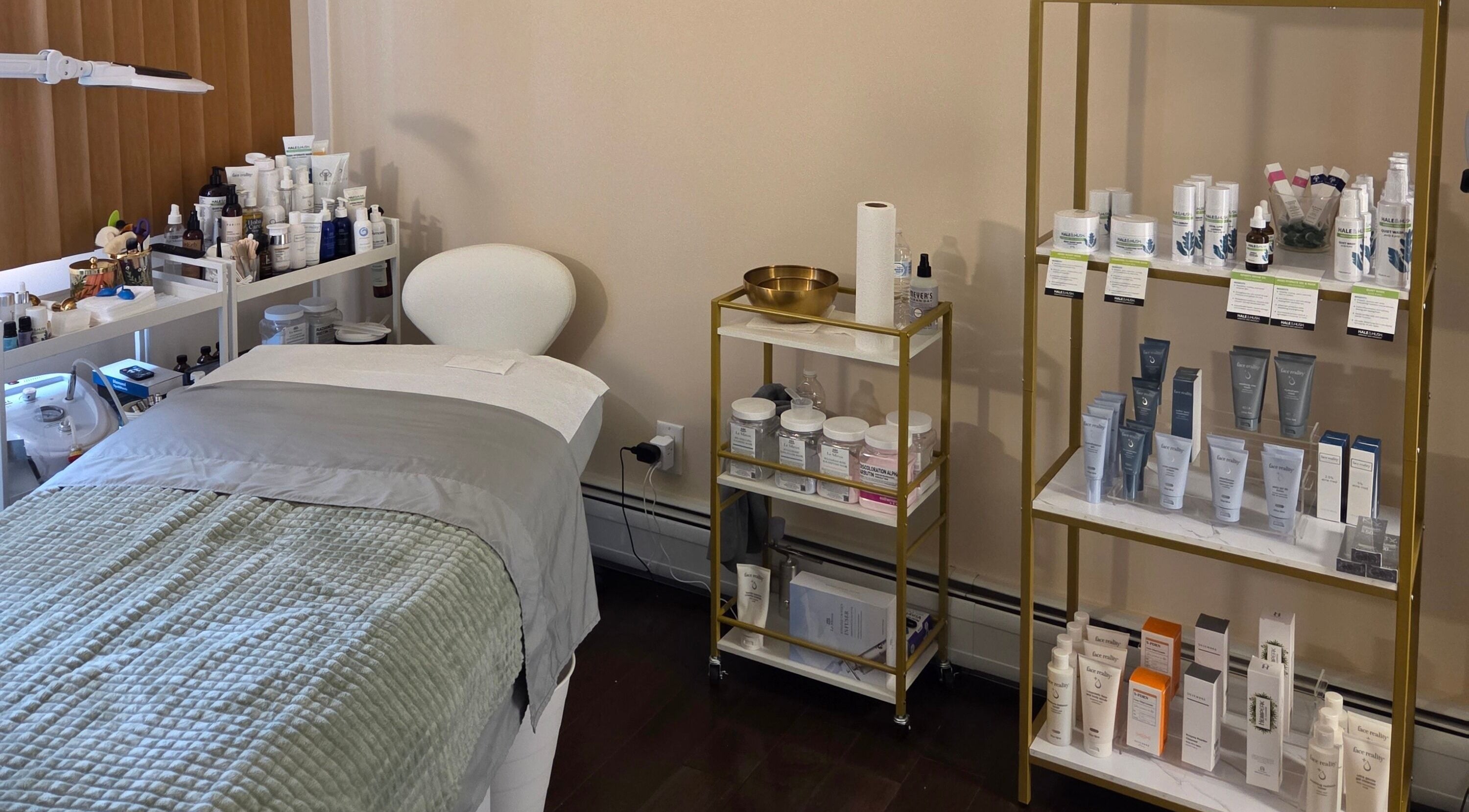 Innersol Skincare treatment room in Fair Lawn, New Jersey, US showcasing products and a cozy bed.