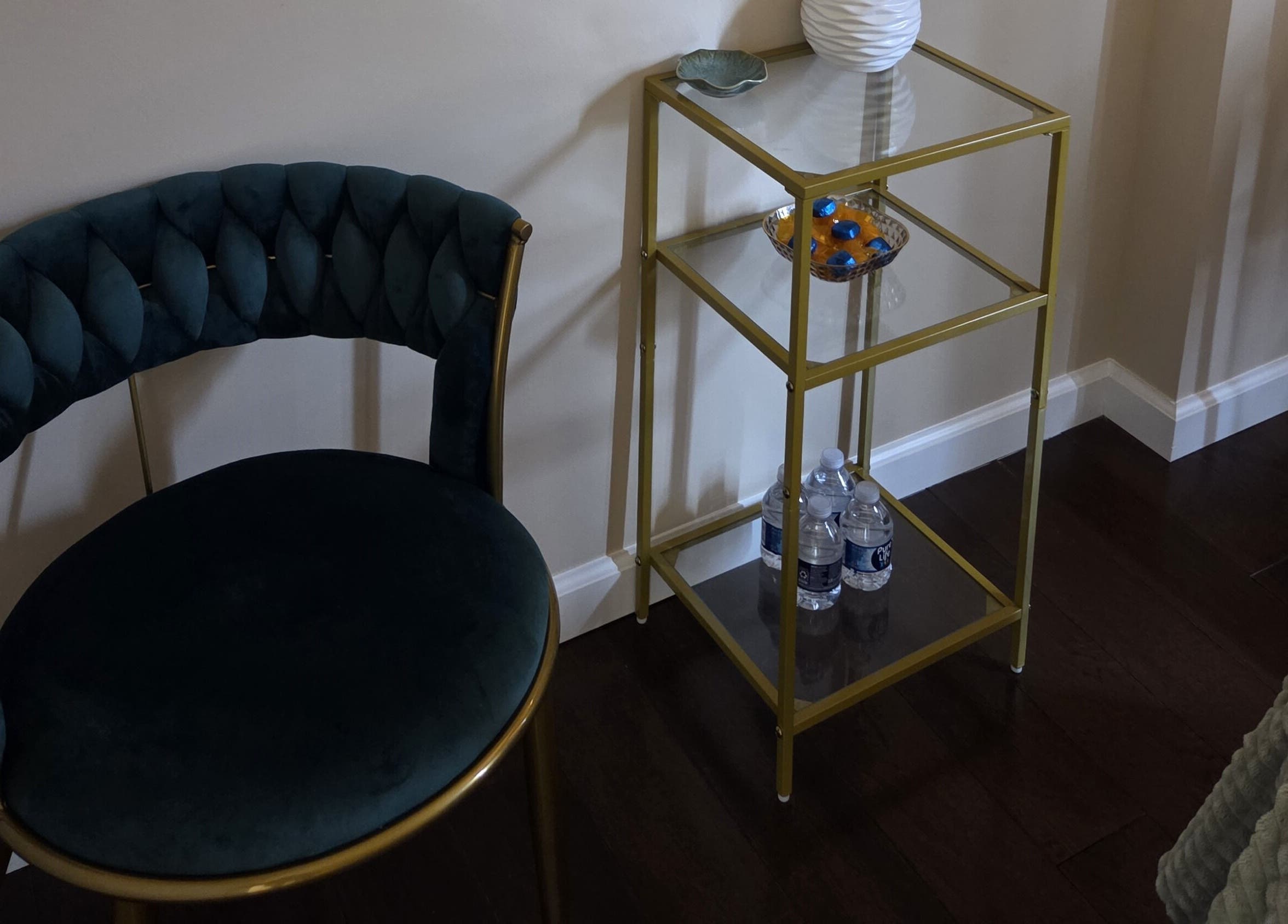 Elegant seating area at Innersol Skincare, Fair Lawn, New Jersey, US showcasing a chic chair and glass table.