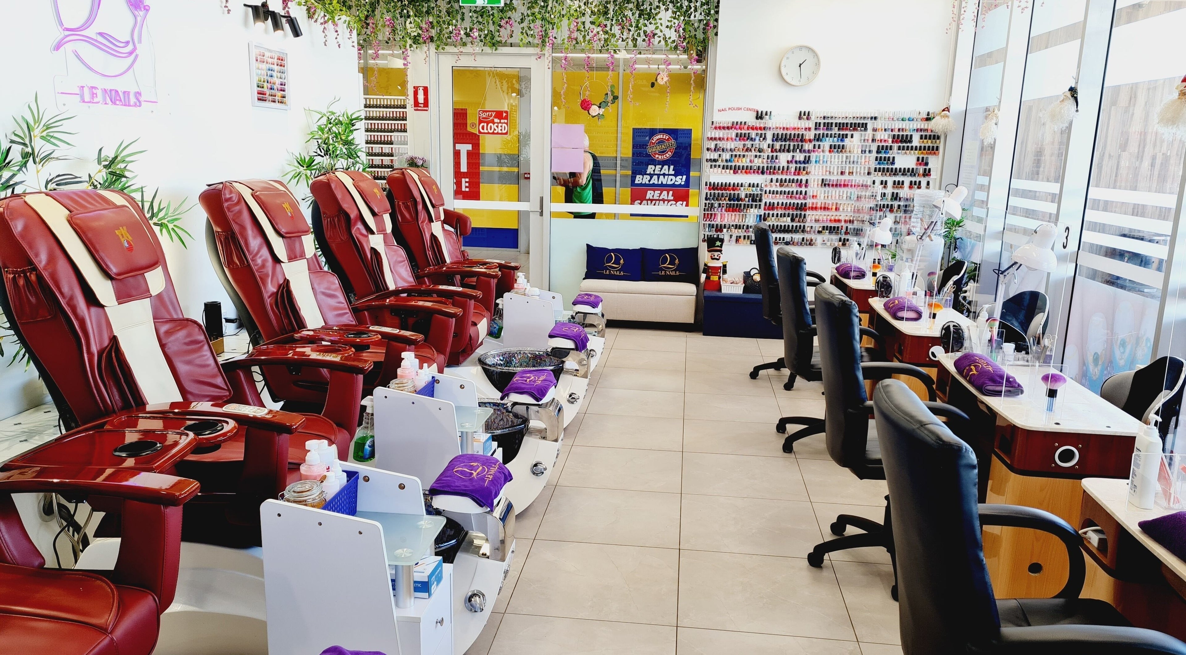Spacious interior of Le Nails and Beauty Darwin, Marrara, NT, featuring plush chairs and nail stations.