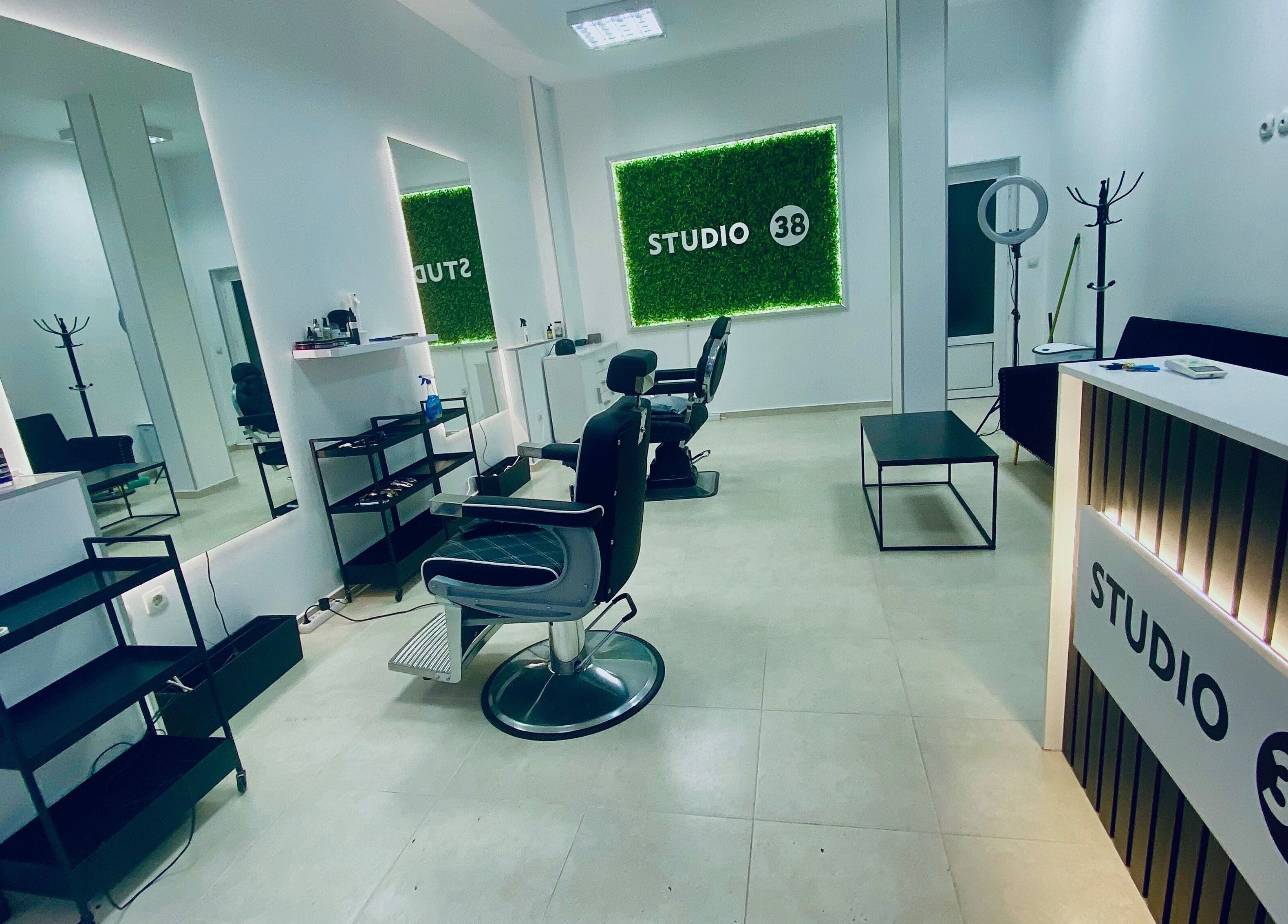 Modern interior of Studio 38 Barber Shop in Plovdiv, Plovdiv, BG with stylish decor and barber chairs.