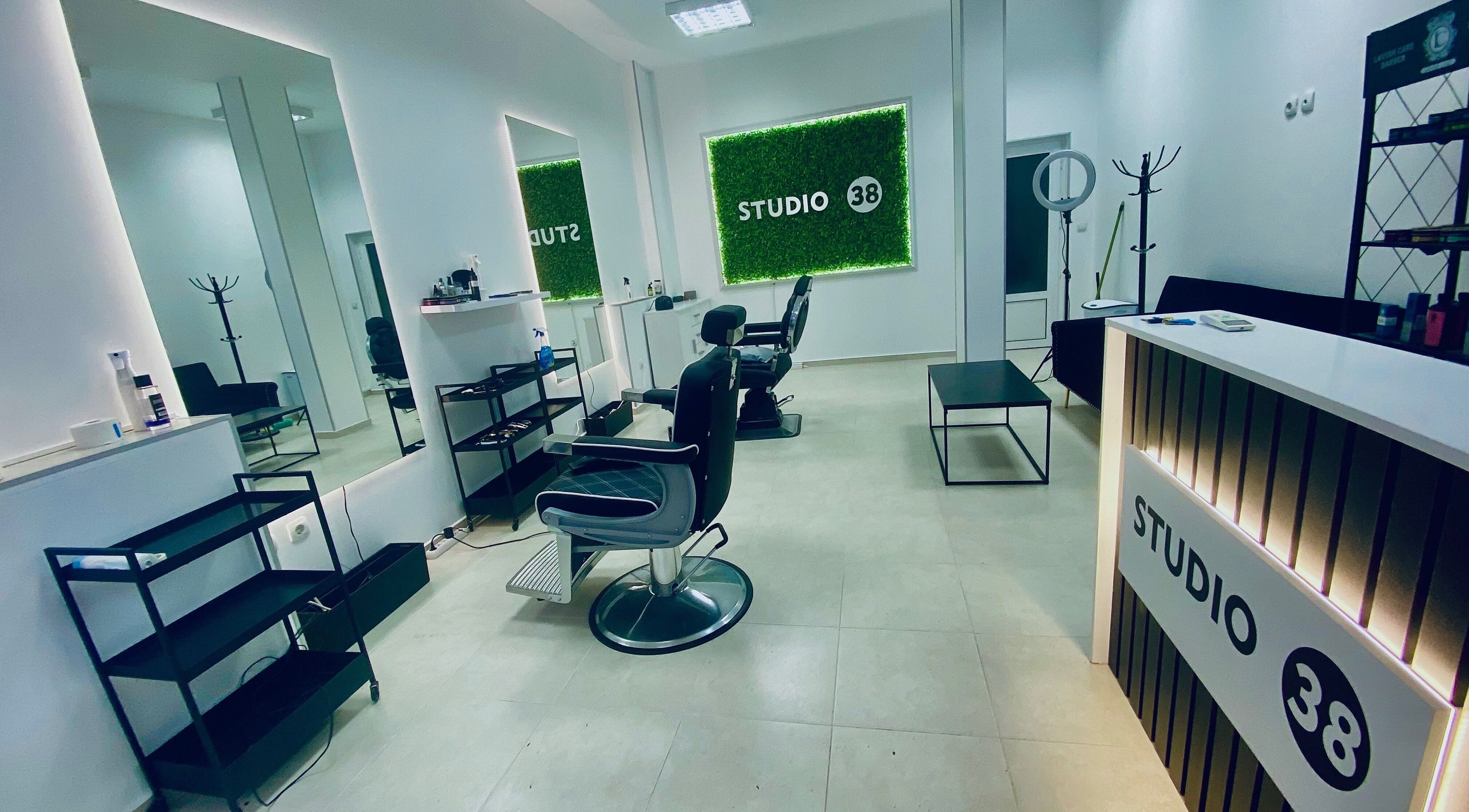 Modern interior of Studio 38 Barber Shop in Plovdiv, Plovdiv, BG with stylish decor and barber chairs.
