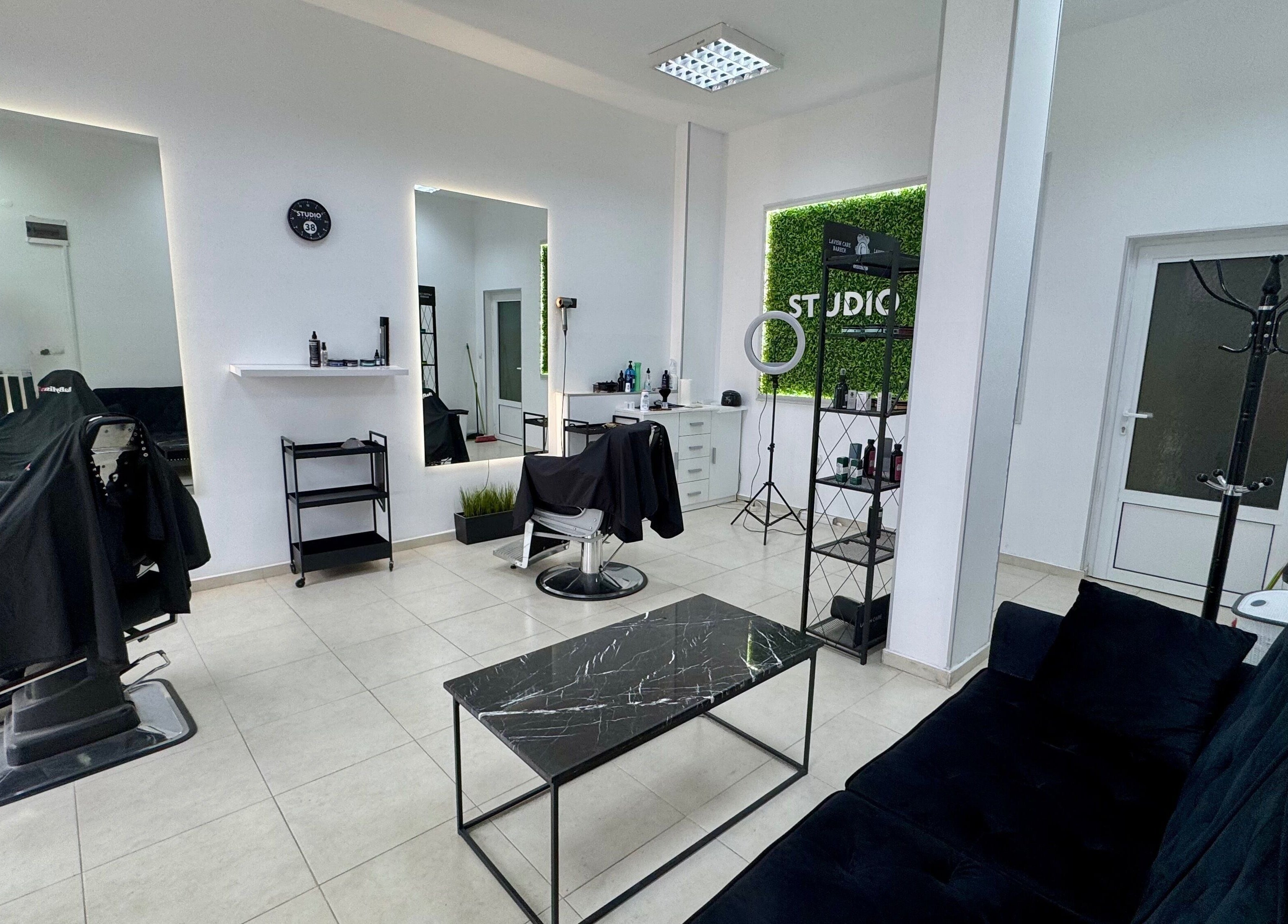 Modern interior of Studio 38 Barber Shop in Plovdiv, Plovdiv, BG featuring barber chairs and stylish decor.