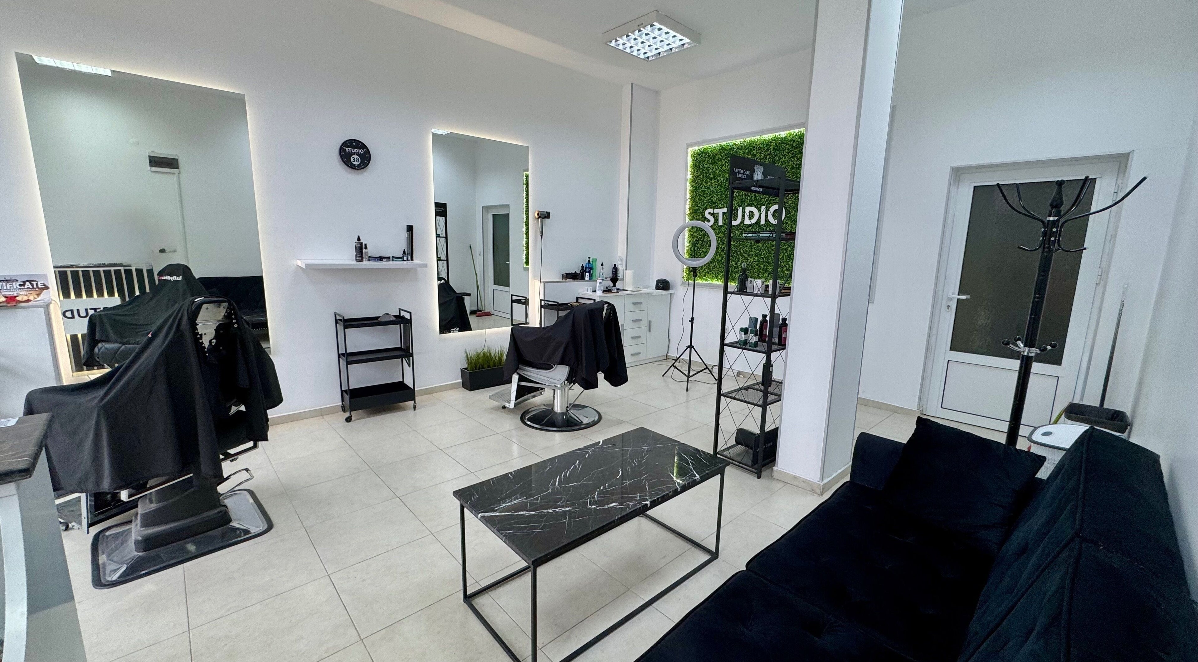 Modern interior of Studio 38 Barber Shop in Plovdiv, Plovdiv, BG featuring barber chairs and stylish decor.