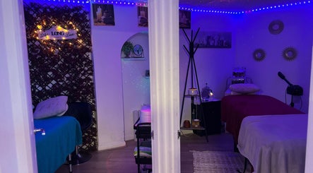 Cozy treatment room at Unique Beauty House, Reading, England, GB, with calming decor and ambient lighting.