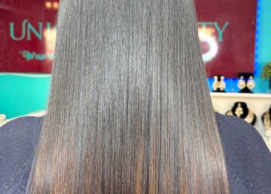 Straight, shiny hair styled at Unique Beauty House, Reading, England, GB.